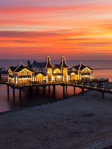 Preview wallpaper pier, buildings, lights, illumination, sea, beach