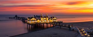 Preview wallpaper pier, buildings, lights, illumination, sea, beach