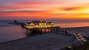 Preview wallpaper pier, buildings, lights, illumination, sea, beach