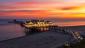 Preview wallpaper pier, buildings, lights, illumination, sea, beach