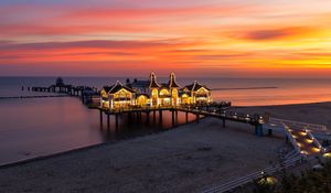 Preview wallpaper pier, buildings, lights, illumination, sea, beach