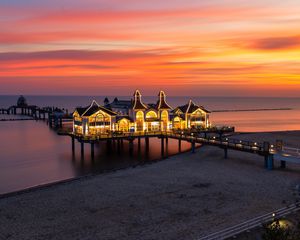 Preview wallpaper pier, buildings, lights, illumination, sea, beach