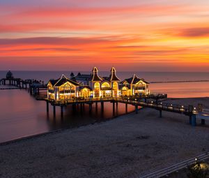 Preview wallpaper pier, buildings, lights, illumination, sea, beach