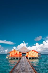 Preview wallpaper pier, buildings, ocean, coast, tropics
