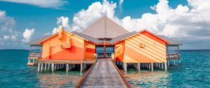 Preview wallpaper pier, buildings, ocean, coast, tropics