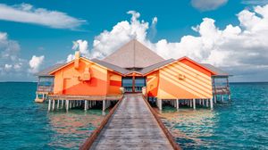 Preview wallpaper pier, buildings, ocean, coast, tropics
