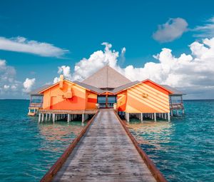 Preview wallpaper pier, buildings, ocean, coast, tropics
