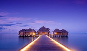 Preview wallpaper pier, bungalow, buildings, backlight, ocean