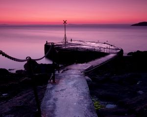 Preview wallpaper pier, chain, sea, evening, sign