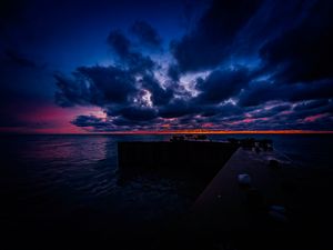 Preview wallpaper pier, clouds, sunset, ocean, horizon, dark