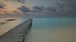 Preview wallpaper pier, coast, sand, horizon, clouds