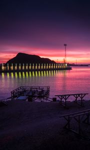 Preview wallpaper pier, coast, sunset, mountains, glow
