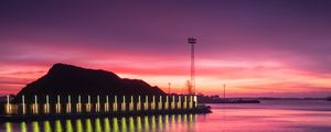 Preview wallpaper pier, coast, sunset, mountains, glow