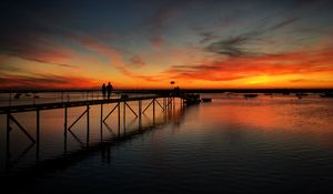 Preview wallpaper pier, couple, silhouettes, sea, evening