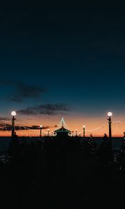 Preview wallpaper pier, dark, garlands, lights, silhouettes