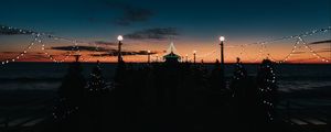 Preview wallpaper pier, dark, garlands, lights, silhouettes