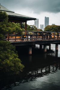 Preview wallpaper pier, gazebo, buildings, pilings, water