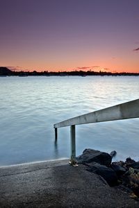 Preview wallpaper pier, handrail, stones, water, flooding, evening