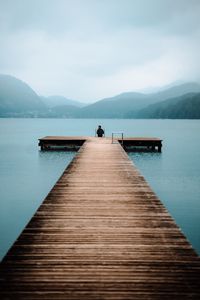Preview wallpaper pier, lake, loneliness, fog, man