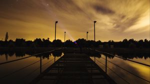 Preview wallpaper pier, lake, sunset, starry sky