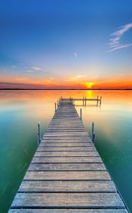 Preview wallpaper pier, lake, sunset, water, horizon