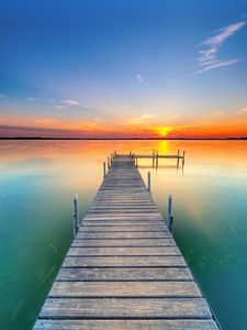 Preview wallpaper pier, lake, sunset, water, horizon
