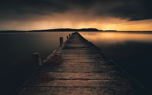 Preview wallpaper pier, lake, sunset, dusk, water