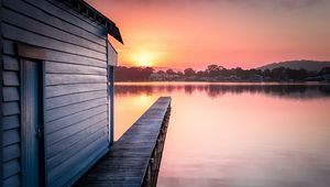 Preview wallpaper pier, lake, water, sun, sunset