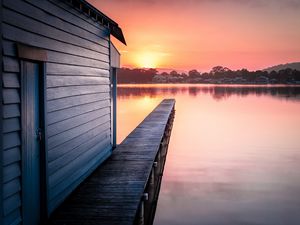 Preview wallpaper pier, lake, water, sun, sunset