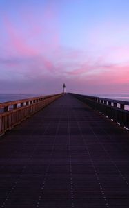 Preview wallpaper pier, lighthouse, horizon, dawn, sea, sky