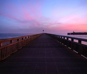 Preview wallpaper pier, lighthouse, horizon, dawn, sea, sky