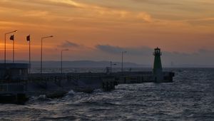 Preview wallpaper pier, lighthouse, sea, waves, sunset