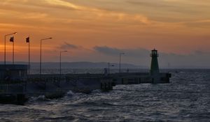 Preview wallpaper pier, lighthouse, sea, waves, sunset