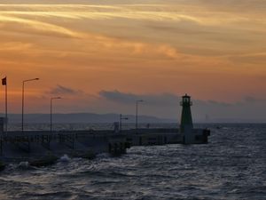 Preview wallpaper pier, lighthouse, sea, waves, sunset