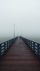 Preview wallpaper pier, man, alone, fog, sea