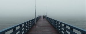 Preview wallpaper pier, man, alone, fog, sea