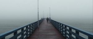 Preview wallpaper pier, man, alone, fog, sea