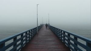 Preview wallpaper pier, man, alone, fog, sea