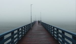 Preview wallpaper pier, man, alone, fog, sea