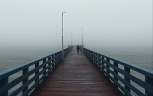 Preview wallpaper pier, man, alone, fog, sea