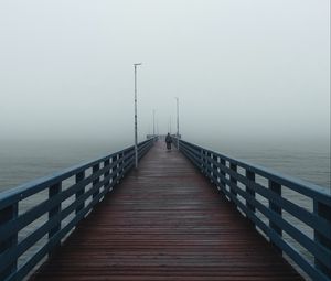 Preview wallpaper pier, man, alone, fog, sea