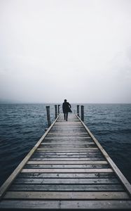 Preview wallpaper pier, man, sea, loneliness, horizon