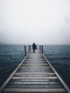 Preview wallpaper pier, man, sea, loneliness, horizon