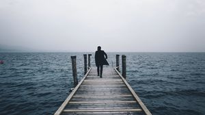 Preview wallpaper pier, man, sea, loneliness, horizon