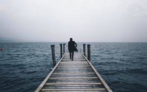 Preview wallpaper pier, man, sea, loneliness, horizon