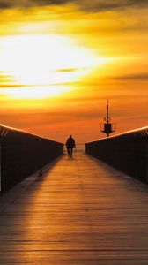 Preview wallpaper pier, man, silhouette, alone, sea, sunset