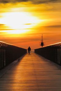 Preview wallpaper pier, man, silhouette, alone, sea, sunset