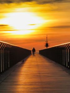 Preview wallpaper pier, man, silhouette, alone, sea, sunset