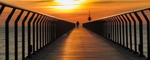 Preview wallpaper pier, man, silhouette, alone, sea, sunset