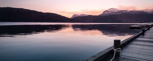 Preview wallpaper pier, mountains, lake, rope, sunset